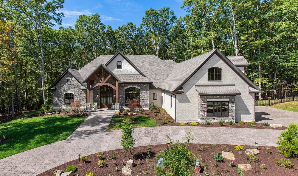 Completed custom home with a landscaped front garden